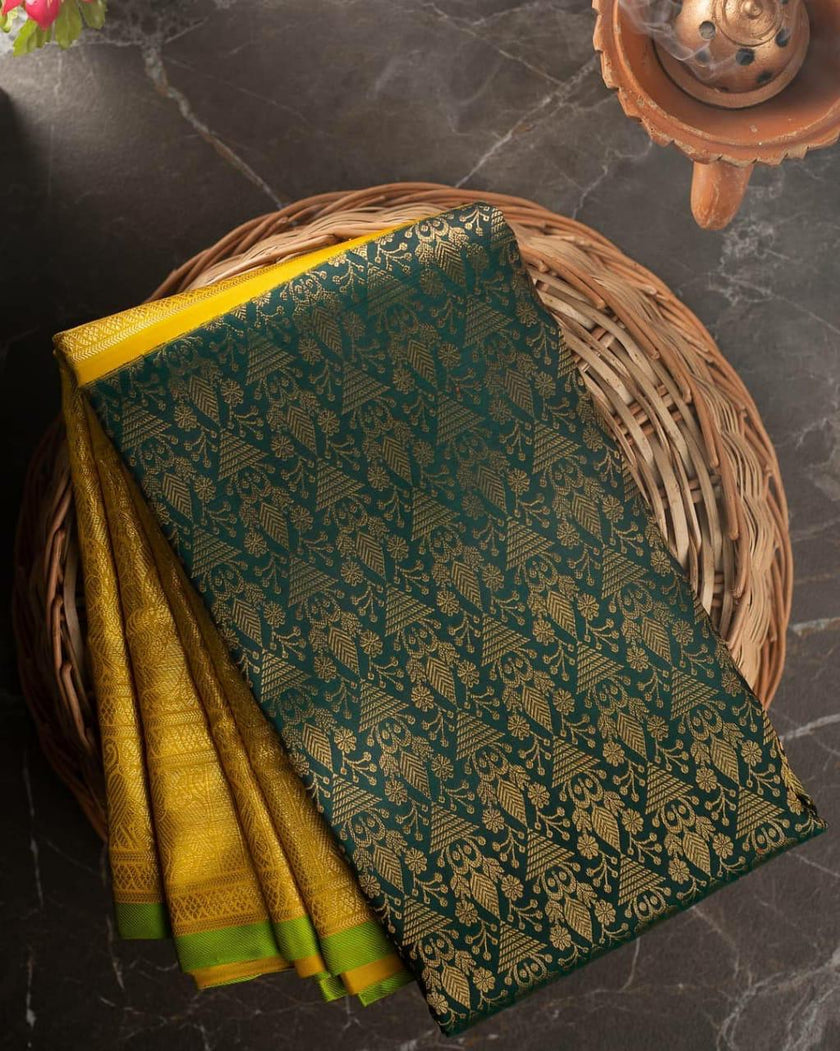 Valiba Kanchipuram silk saree has brocade of gold zari flower pots With edge and rich brocade Saree