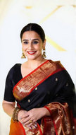 Elegant Midnight Black Silk Saree with Vibrant Orange-Red Banarasi Zari Border & Tassels