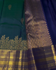 Sharvitha – Green and Navy Kanyaaram Silk Saree with Heavy Golden Zari Border and Floral Pallu
