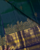 Sharvitha – Green and Navy Kanyaaram Silk Saree with Heavy Golden Zari Border and Floral Pallu