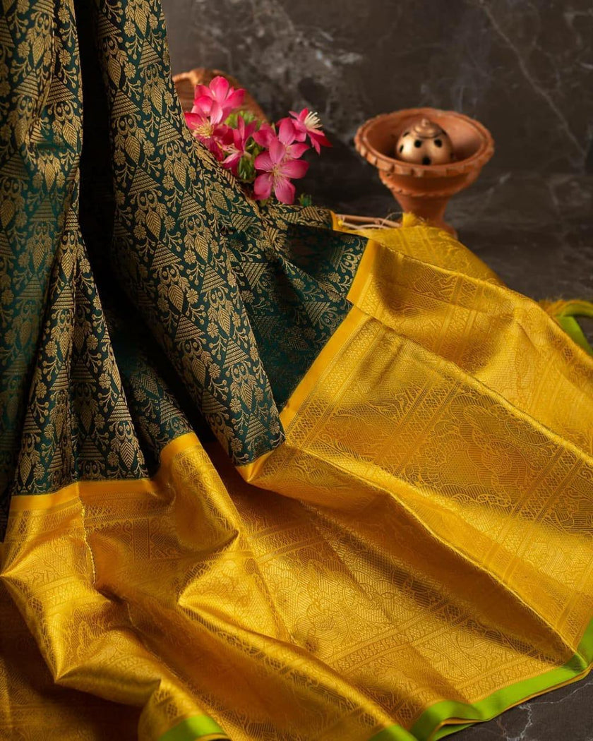 Valiba Kanchipuram silk saree has brocade of gold zari flower pots With edge and rich brocade Saree
