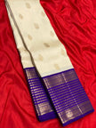 Ivory Pearl Banarasi Silk Saree with Royal Blue Antique Zari Border
