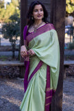 Mint Aura Banarasi Silk Saree with Royal Purple Zari Border