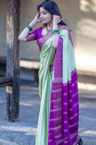 Mint Aura Banarasi Silk Saree with Royal Purple Zari Border
