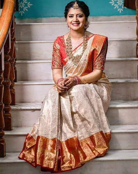 Traditional Off White Kanjivaram Silk Saree with Red Contrast Border & Rich Gold Zari Weaving