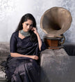 Designer Black Satin Silk Saree with Metallic Striped Weaving & Elegant Modern Drape
