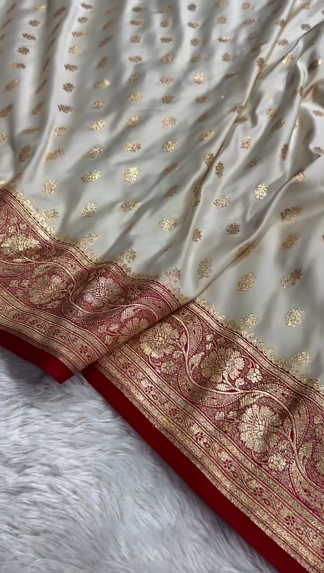 Ivory Banarasi Silk Saree with Golden Zari Buttas & Rich Paisley Border